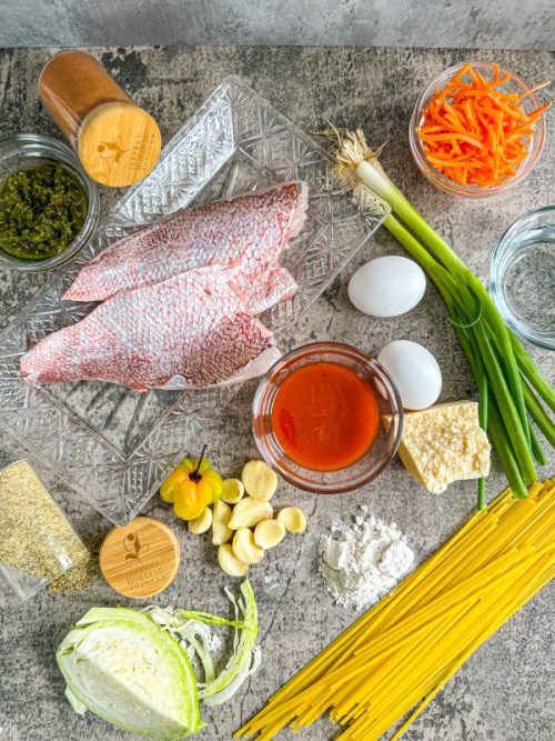 The colorful ingredients of Chef Jeff's salt and pepper snapper bites and garlic butter pasta, viewed from above.