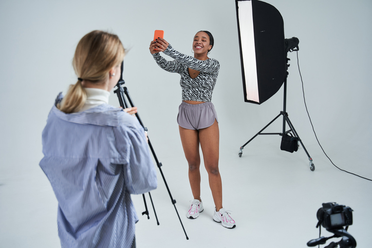 Photographer having break from photo shoot promoting diversity and inclusion