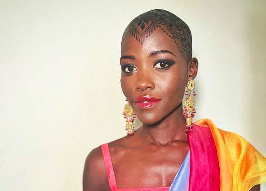 Lupita Nyong'o Jugua stained bald baldie Indian wedding henna ink