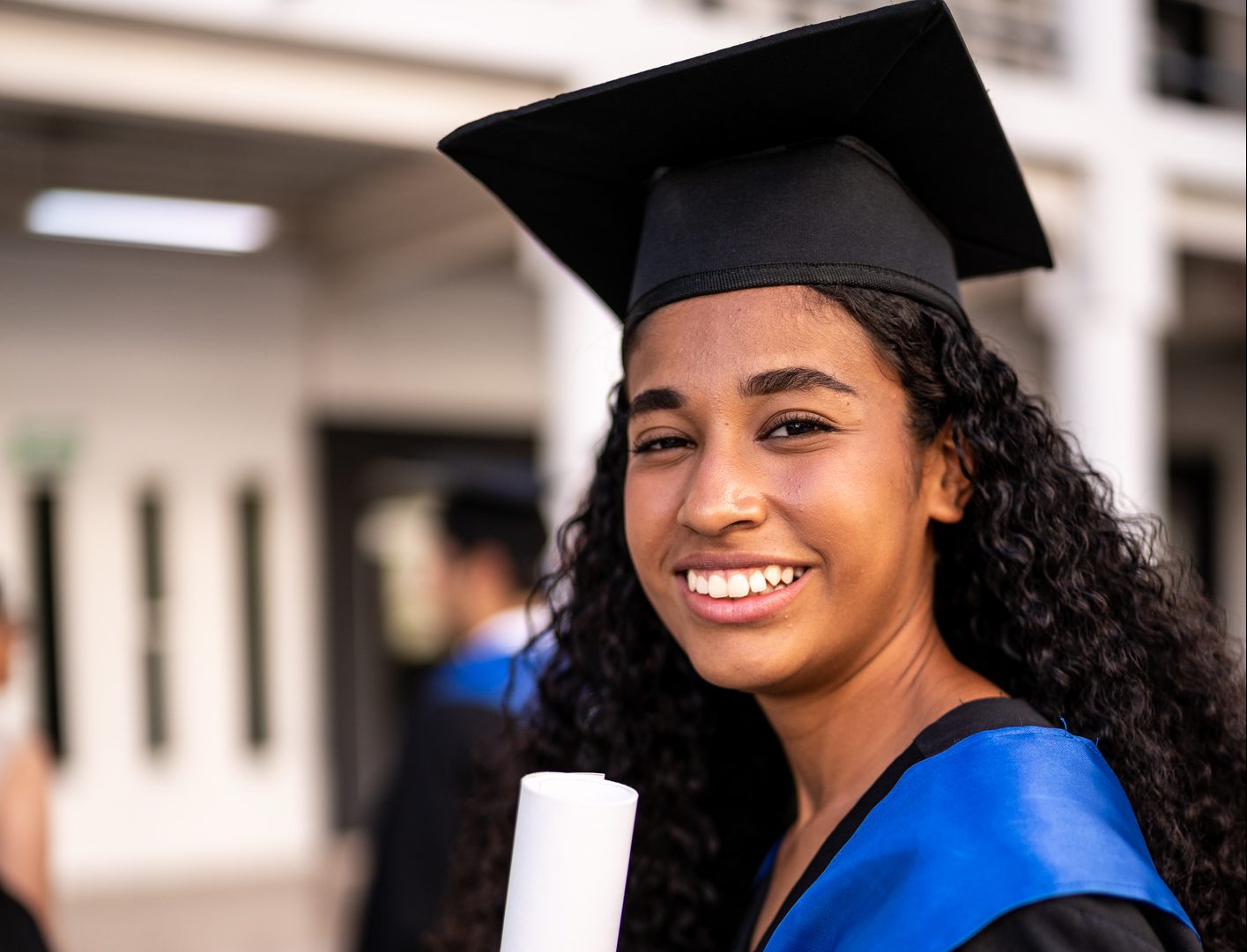 Portrait of young graduate woman on her graduation