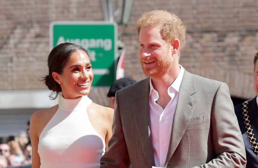 Meghan Markle Prince Harry engagement ring photos diamond marriage royals