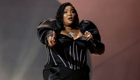 Lizzo Became the Grinch With Green Hair, a Striped Bodysuit, and a Corset —  See the Photos