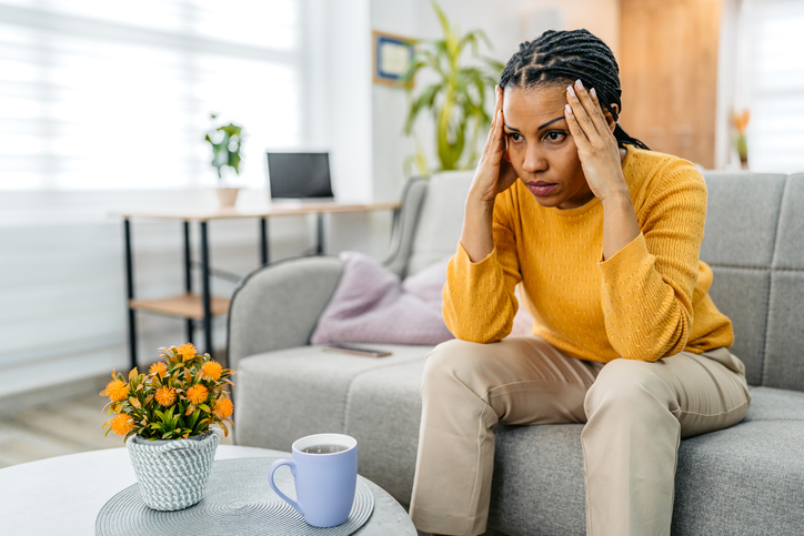 Young Woman Having A Headache At Home