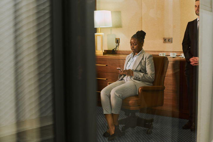 Financial director texting in smartphone