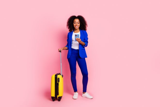 Photo of lovely charming girl wear stylish blue clothes booking hotel weekend tour isolated on pink color background