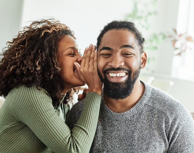 woman couple man happy happiness love young gossip secret whispering communication whisper talking ear friend friendship news talk surprise listening expression conversation telling rumor