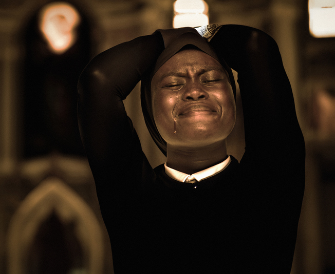 Woman crying holding her head