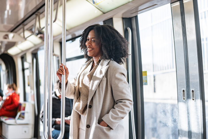 Cheerful Black Businesswoman Enjoying Metro Ride