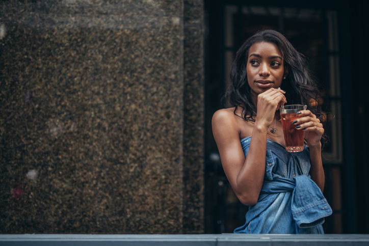 Black woman drinking soda
