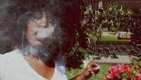 Young Woman Smoking At Park