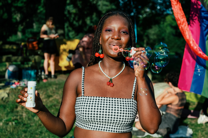 Young woman enjoying the outdoors at a pride event