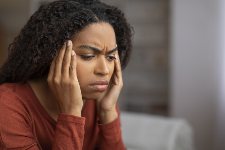 Headache Concept. Closeup Shot Of Stressed Black Woman Touching Head With Hands