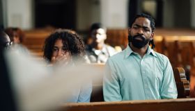 Congregation members sitting in church pew listening to sermon
