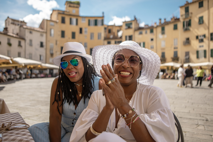 Small group of luxury friends sightseeing in Lucca