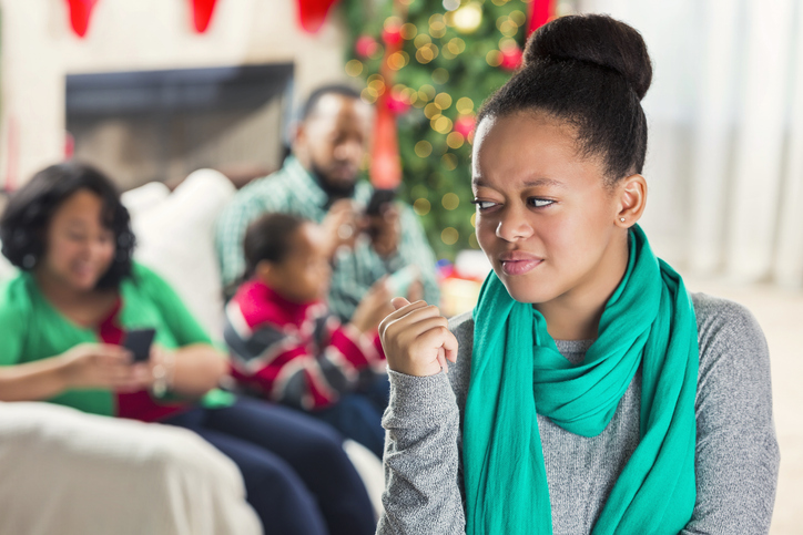 Teenager is upset with family's use of technology at Christmastime