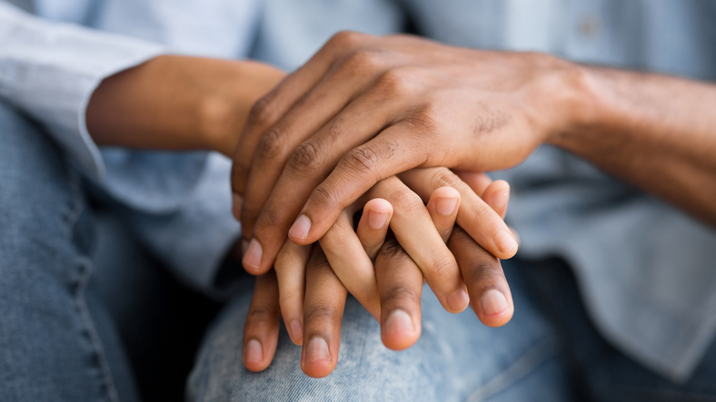 Young Afro Couple Holding Hands At Psychologist's Office Closeup