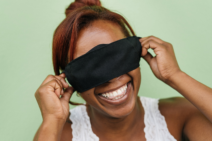 Fun woman with protective mask covering her eyes