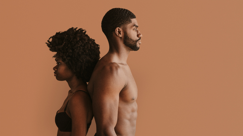 Seminude black couple