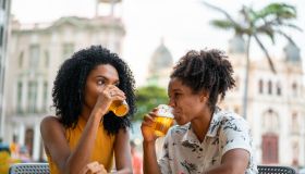 Friends drinking beer at the bar in Recife Pernambuco