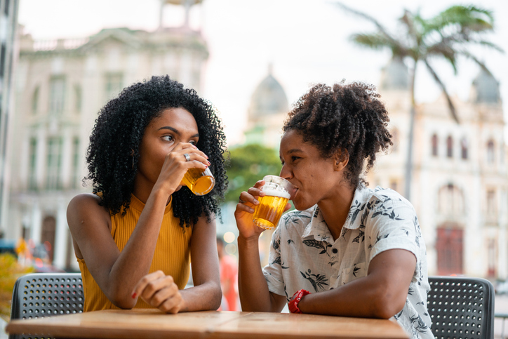 Friends drinking beer at the bar in Recife Pernambuco