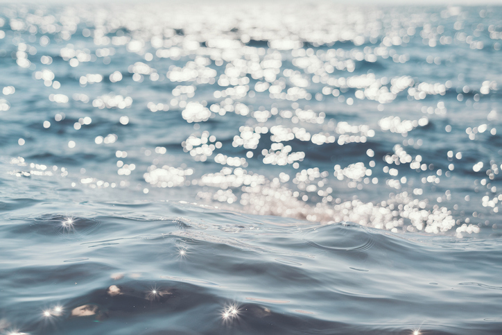Abstract blurred image of blurred soft light bokeh on the sea background