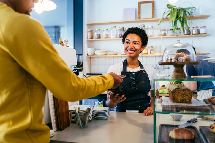 Barista working in a bar cafeteria