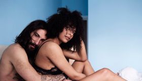 Affectionate young couple hugging in bed