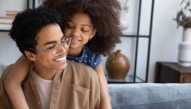 Happy bonding African American family enjoying time together.