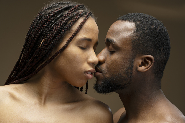 Young Couple Sharing a Tender Kiss with Closed Eyes