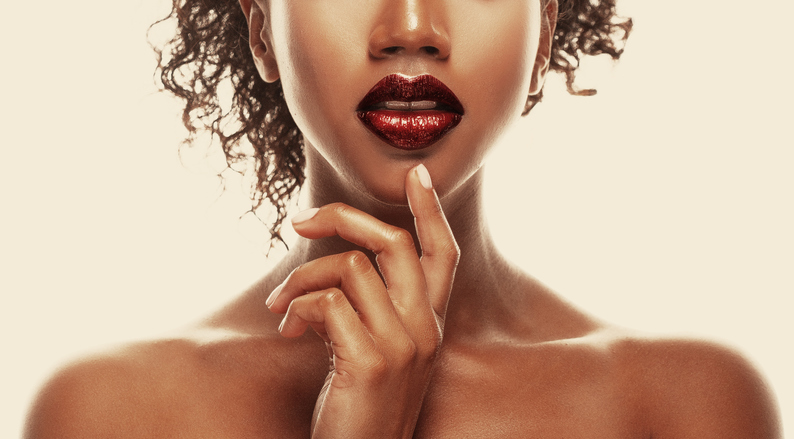 Fashion makeup. Close-up of lips African American young woman.