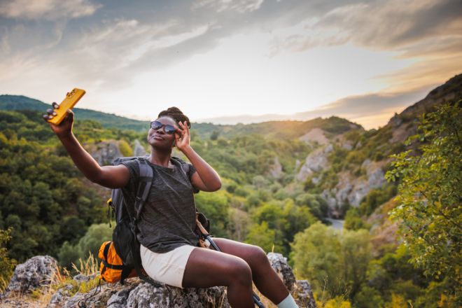 Female Trekker Taking Selfie Photo in the Mountains