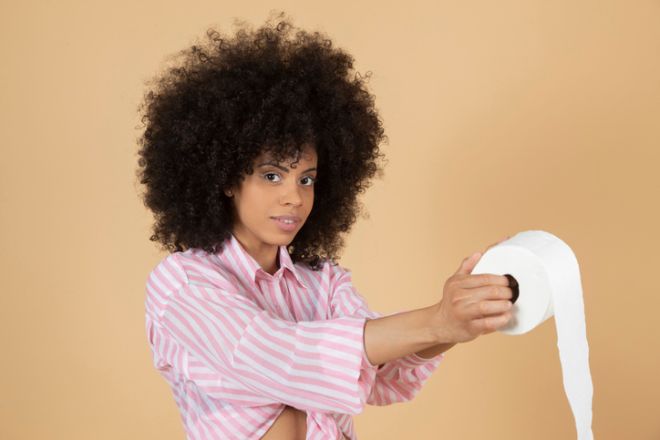 Latin American woman, with toilet paper