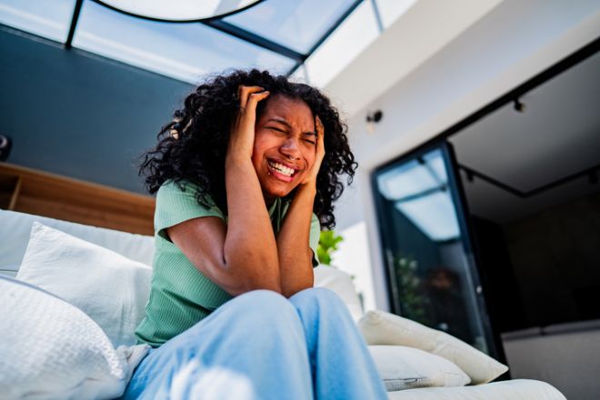 Anger young woman at home