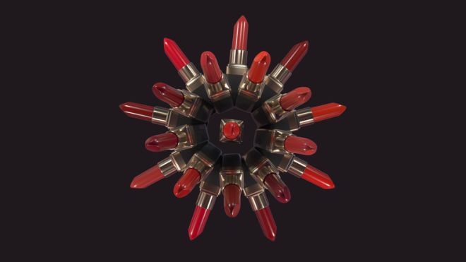 Lipsticks forming a circle on a dark background