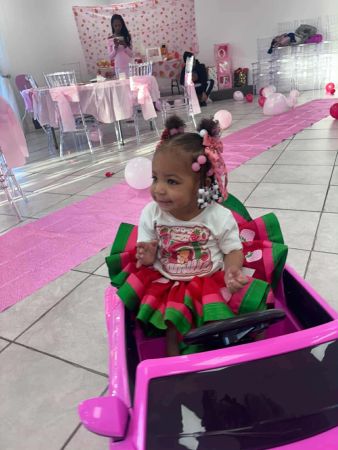 Baby Camille at empty birthday party