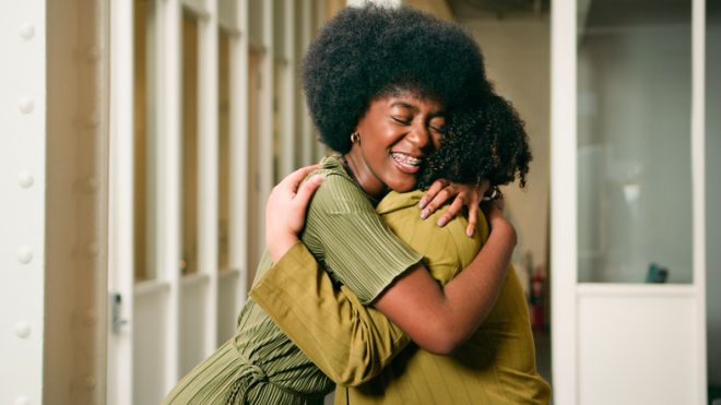 Joyful Embrace Between Friends: Warm Hug, Happiness, Connection, and Shared Moments of Support