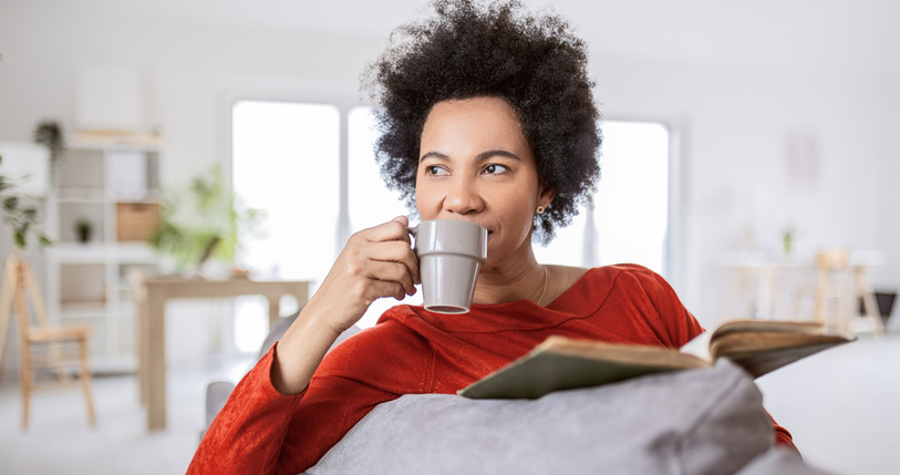Positive Lifestyle Scene with Reader Book and Coffee