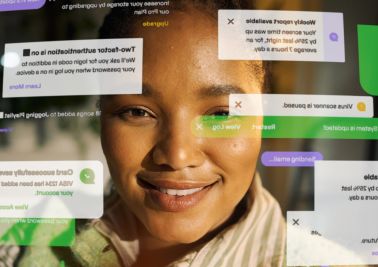 Young woman smiling with overwhelming digital notification pop ups