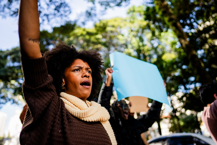 Young woman protesting outdoors