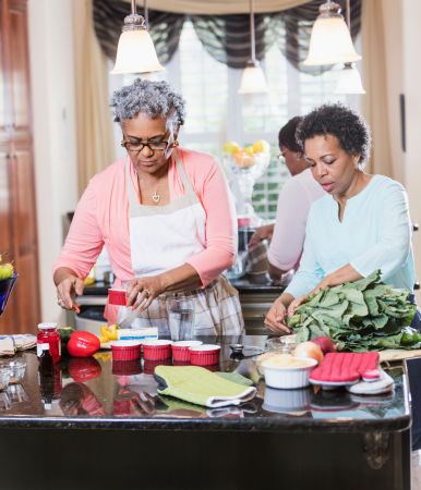 African-American women in kitchen cooking