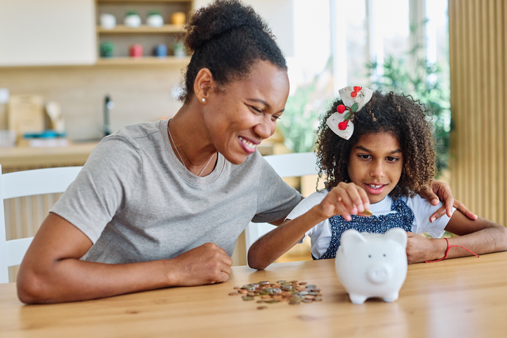 child money saving family coin mother finance bank piggybank daughter girl investment financial cash kid safety
