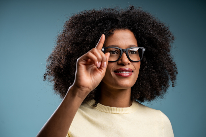 Woman with Afro Hair Wearing AR Smart Glasses, Futuristic Technology Look