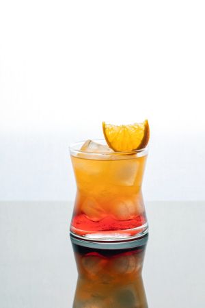 Summer alcoholic drink tequila sunrise with tequila, grenadine syrup and orange juice