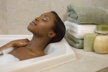Woman relaxing in a tub