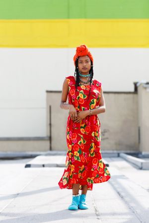 Hip, young African American model wearing summer dress