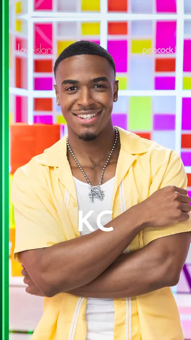 A smiling young man wearing a yellow jacket and necklace stands in front of a colorful abstract background with the text "Love Island" and "Peacock".
