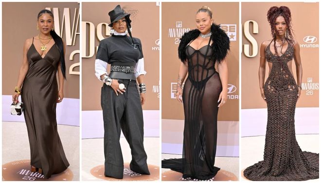 Four women wearing glamorous evening gowns and posing on a red carpet at an awards show event.