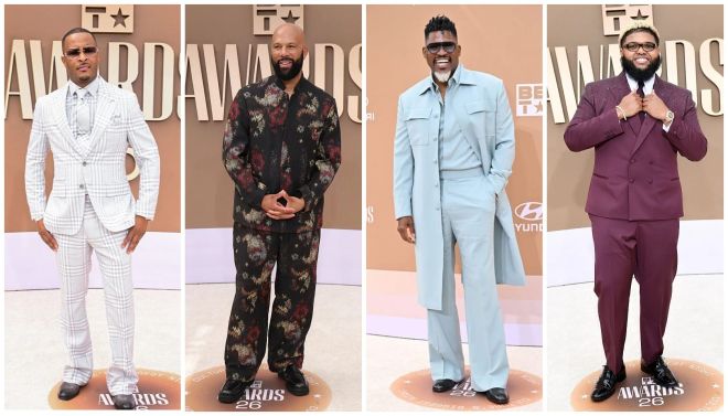 Four men in stylish suits and formal attire posing at an awards show event.