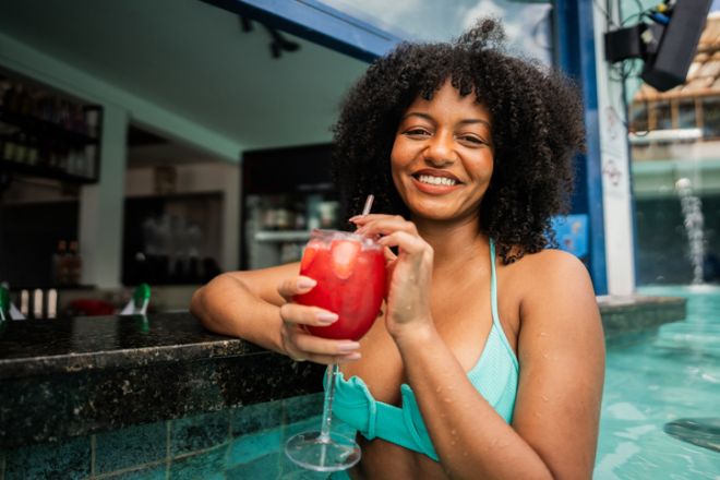Portrait of a mid adult woman at pool bar