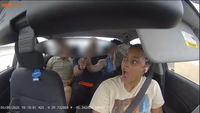 A woman in a car appears to be shouting 
